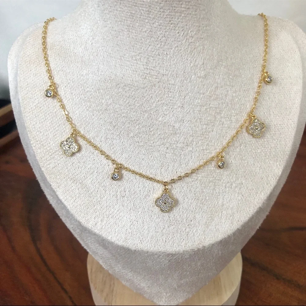 gold dangle station necklace encrusted clover charm round bezel set Cubic Zircon